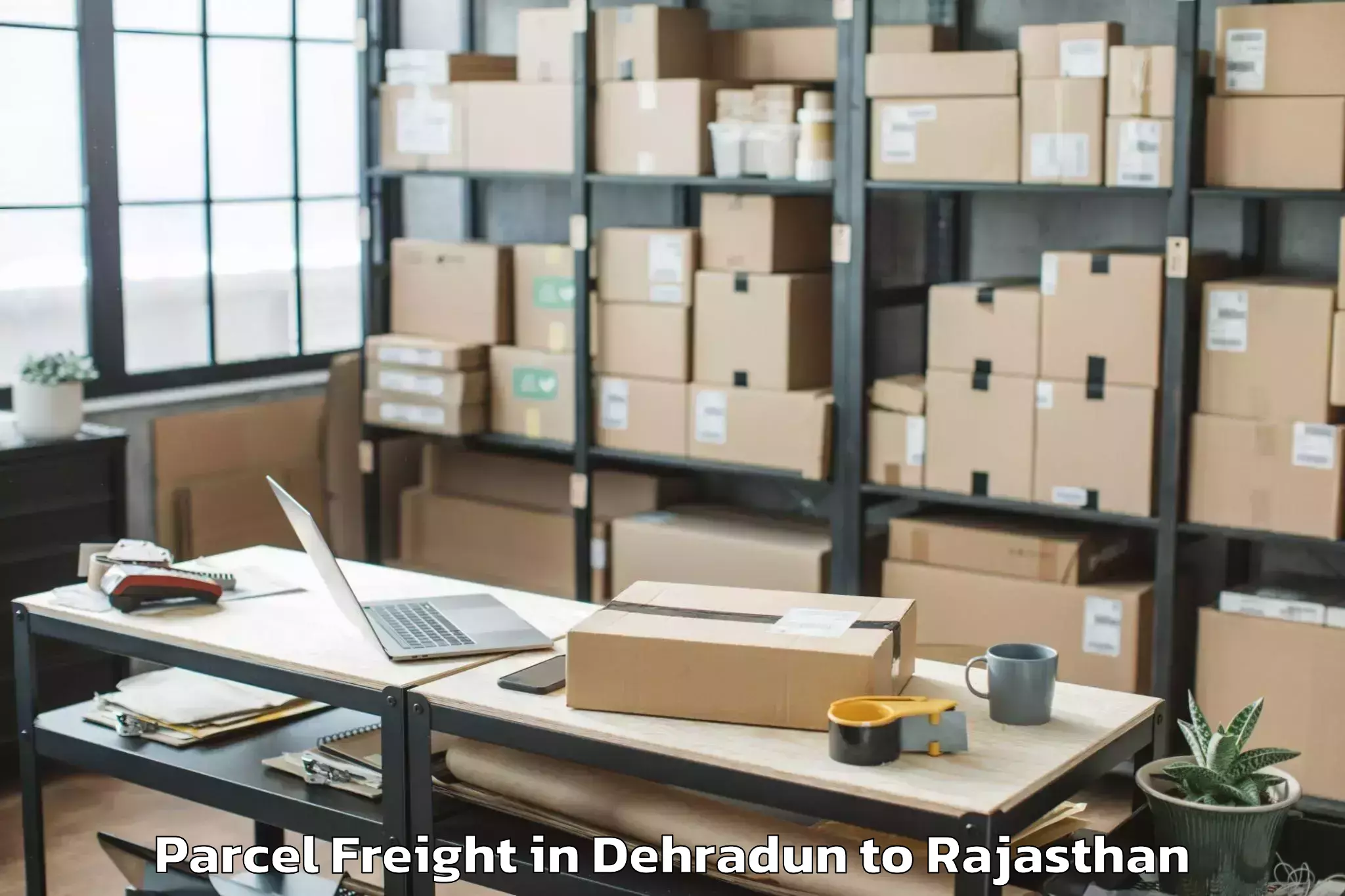 Book Your Dehradun to Bari Sadri Parcel Freight Today